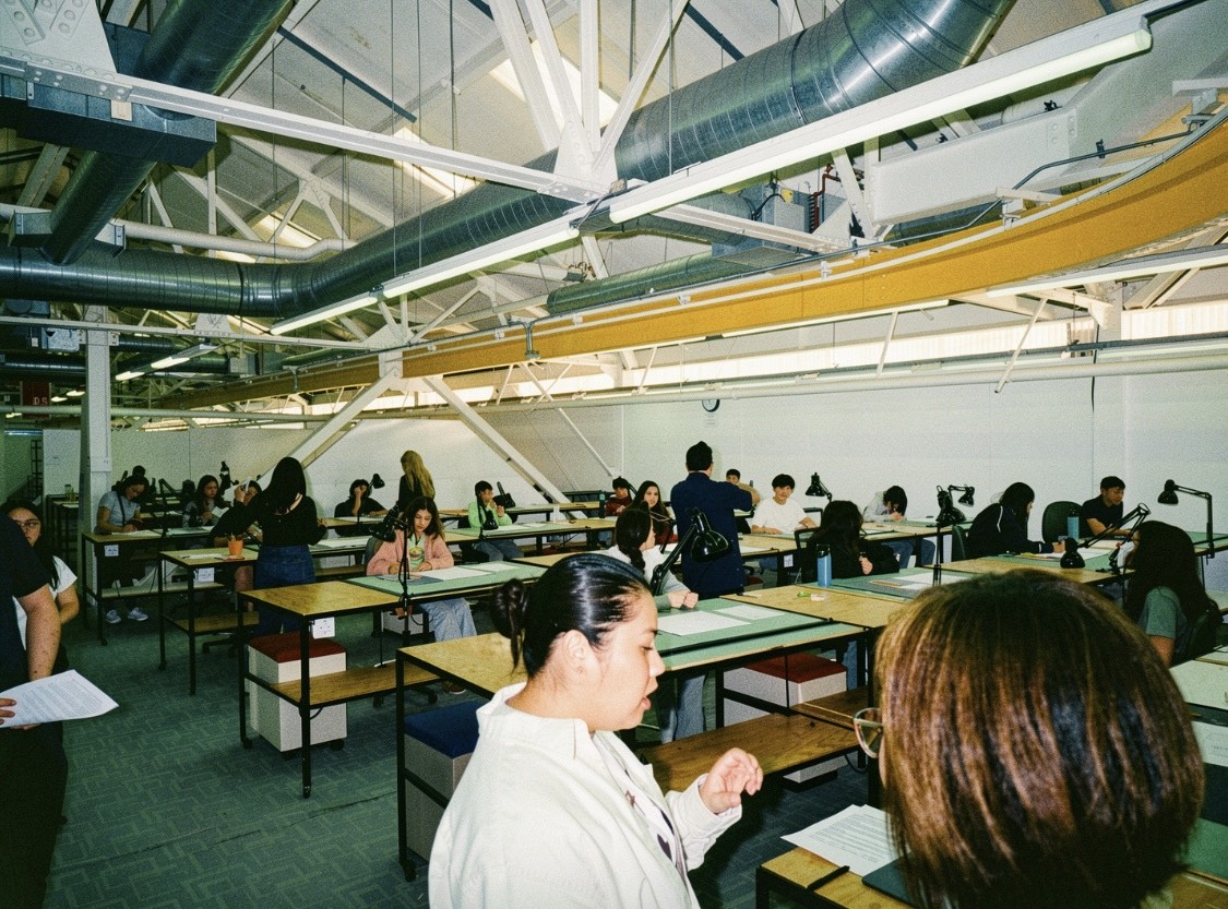 Students working at drafting tables during the workshop